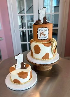 two cakes decorated with brown and white designs