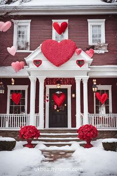 a house decorated for valentine's day with paper hearts