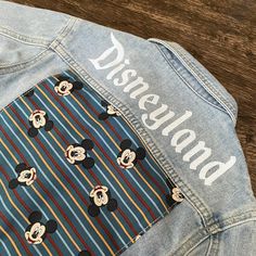 Looking for the perfect denim jacket? Look no further! Our Disneyland Mackey Denim Jacket is the ultimate choice for any occasion, whether it's a night out at Disneyland or a casual day out. The wash off varies and unique fabric prints, these jackets are true to size and can also be worn as an oversized fit if you size up. For example, if your child wears a true size 3t, the 3t-4t option will fit perfectly oversized, but the 3t-4t size will also provide a perfect fit for regular wear. Say goodby Unique Fabric Prints, Disney Themed Outfits, Perfect Denim, Fabric Prints, Unique Fabric, Themed Outfits, Barbie Collection, Glass Bracelet, Days Out