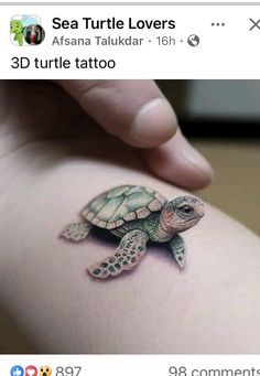 a small turtle tattoo on the back of a woman's thigh