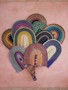 Several African Bolga Fans, handwoven in Ghana, presented like a bouquet. Hand Fan Decor, Decorative Wall Baskets, Moroccan Wall Decor, Boho Wall Baskets, Woven Wall Baskets, African Inspired Decor, Basket Wall Art, Moroccan Wall, Bolga Basket