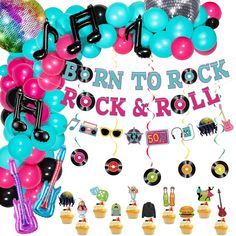 a party decoration with balloons, streamers and music notes on the wall for a rock and roll themed birthday