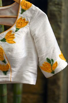 Details: Fabric – Pure rawsilk Lining - Yes Detail- Yellow piping Blouse Pads – Yes (Removable on request) Opening - Back hooks Length: 15 inches (On a size 34”) Care: Dry Clean This product has been hand painted and hand embroidered and may have slight variations. SIZE NOT AVAILABLE? worry not! All your blouses are made-to-order, Please contact support@houseofblouse.com for customisations, size availability and other assistance. WhatsApp: +91 81050 68601 Or call on +91 8880811012 CUSTOMISATIONS U Neck Blouse, Piping Blouse, Add Sleeves, Blouse Designs Indian, Simple Blouse Designs, Ladies Blouse Designs