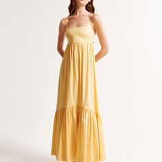 Nwt! Never Before Worn Abercrombie Dress. Flattering Longer-Length Maxi Dress In Our Stretchy Taffeta Fabric With A Shiny Finish And Babydoll Silhouette, Featuring Adjustable Straps, Bow-Back Detail And A Drama Tiered Skirt. Body:66% Polyester, 30% Nylon, 4% Elastane / Upper Body Lining:66% Polyester, 30% Nylon, 4% Elastane Machine Wash Cold Separately, Gentle Cycle Only Non-Chlorine Bleach Line Dry Low Iron If Needed Do Not Dry Clean Yellow A-line Midi Dress For Casual Occasions, Yellow A-line Maxi Dress For Brunch, Taffeta Gown, Abercrombie And Fitch Dresses, Taffeta Fabric, Bow Back, Sunny Yellow, Tier Skirt, Tiered Skirt