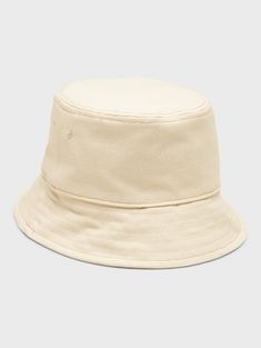 A classic bucket hat made in soft, washed canvas.  Circumference: S/M 24" (61cm), L/XL 25" (63. 5cm) Brim width: 2. 375" (6cm) Beige Cotton Bucket Hat With Short Brim, Beige Cotton Bucket Hat For Everyday Wear, Adjustable Cream Cotton Bucket Hat, Beige Canvas Bucket Hat For Summer, Cream Brimmed Cotton Bucket Hat, Casual Solid Brimmed Bucket Hat, Casual Cotton Brimmed Cloche Hat, Casual Solid Color Brimmed Bucket Hat, Casual Brimmed Cotton Cloche Hat