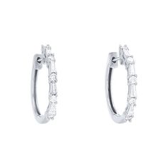 These delicate hoop earrings feature alternating round brilliant cut and baguette cut diamonds, all totaling 0.47 carats. Baguette Diamond Hoop Earrings For Anniversary, Round Hoop Earrings With Baguette Diamonds For Anniversary, Round Baguette Diamond Huggie Earrings For Wedding, Classic Hoop Earrings With Baguette Diamonds, Wedding Huggie Earrings With Baguette Diamonds, Classic Round Diamond Earrings With Baguette Diamonds, Classic White Gold Hoop Earrings With Baguette Cut, Classic Anniversary Hoop Earrings With Baguette Diamonds, Classic Baguette Diamond Huggie Earrings For Anniversary