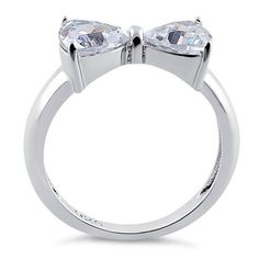 Top of ring height: 7.2mm

Top of ring width: 14.8mm

Band width: 4mm

Shank width: 2.6mm



Stone material: clear cubic zirconia

Stone shape: heart cut

Total number of CZ stones: 2

Stone setting: prong setting



Metal: 925 sterling silver

Plating: rhodium plated

Finish: high polish Bow Ring, Stone Material, Silver Bow, Stone Setting, Cz Ring, Lovely Jewellery, Favorite Rings, Sterling Silver Heart, Cz Stone