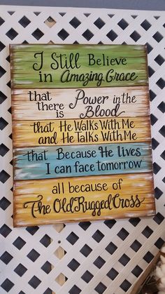 a wooden sign that says i still believe in amazing grace