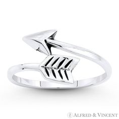 The featured ring is cast in oxidized .925 sterling silver and showcases a bypass ring style made from a finely crafted looped arrow design. Your purchase will include a 30-Day Exchange or Money-Back Guarantee & Free US Shipping. Please email us for more details regarding this listing. Size: 5.  Color: Metal Type.  Gender: female.  Age Group: adult. Silver Pearl Ring, Masonic Ring, Silver Toe Rings, Art Deco Diamond Rings, Bypass Ring, Arrow Design, Diamond Cocktail Rings, Charm Rings, Ring Style