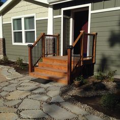 a house with stone steps leading up to the front door