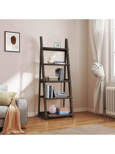 a living room with a couch and book shelf