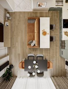 an overhead view of a living room and dining area with wood paneled flooring