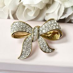 This gorgeous gold plated bow brooch is vintage from the 1980s. With sparkling diamantés. Brooch length: 5cm. Brooch width: 3cm. www.vintageamara.co.uk Bow Brooch, Bow Jewelry, The 1980s, Brooch Pin, Brooches, United Kingdom, Gold Plate, Sparkle, Plating