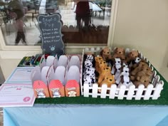 a table topped with lots of stuffed animals