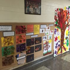 a bulletin board covered in paper and pictures