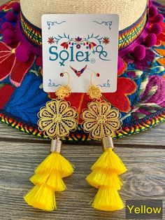 These Beautiful Mexican Earrings are made with the Mexican art form of twisting gold plated wires to create beautifully intricate works of art. The silk thread tassel adds that beautiful pop of color to any outfit. These earrings are handmade by Mexican Artisans. More colors available here: https://www.etsy.com/es/listing/974160414/aretes-mexicanos-de-filigrana-aretes?ref=listing_published_alert Gold Tassel Drop Earrings For Summer, Summer Gold Tassel Earrings, Gold Tassel Jewelry For Summer, Summer Gold Tassel Jewelry, Gold Chandelier Earrings For Summer Gift, Adjustable Gold Bohemian Tassel Earrings, Gold Dangle Tassel Earrings For Summer, Gold Earrings With Latkans For Summer, Elegant Yellow Tassel Earrings