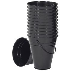 a stack of black cups sitting next to each other