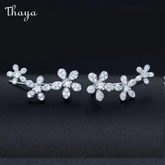 Introducing Thaya's stunning collection of sterling silver jewelry featuring intricate floral and geometric designs. Made of high-quality 925 silver, the pieces are accentuated with sparkling zircon inlays and finished with oxidation for a striking look. The diamonds add an extra touch of luxury to these exquisite pieces, making them the perfect accessory for any occasion. Designed for women, this collection showcases pure silver inlaid with zircon for an elegant and sophisticated finish. Silver Ear Climbers, Ear Crawler Earrings, Crawlers Earrings, Ear Climbers Earrings, Ear Clips, Modern Accessories, Climber Earrings, Geometric Jewelry, Lovely Earrings