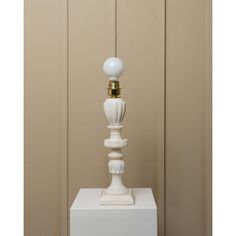 a white table lamp sitting on top of a white box