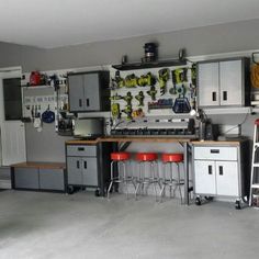 a garage filled with lots of appliances and storage space next to a wall mounted oven