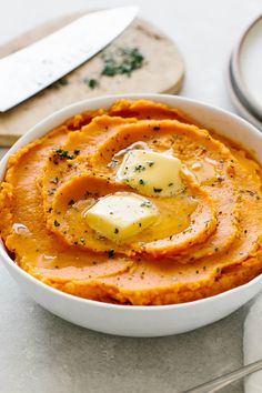 creamy mashed sweet potatoes in a white bowl