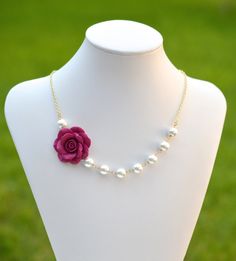 "Details: Rose Flower size is approximately 1.5 inches across. Flower can be placed in left or right side. 8mm white Glass Pearls. Swarovski available with additional cost. Gold Plated Chain. Antiqued Brass and silver plated available. The entire necklace is approximately 18 inches with 2\" extender, finished with lobster clasp. I would be happy to adjust the length if needed. Matching simple matching earrings. Packed in a Gift box. Featuring Magenta Rose Asymmetrical Necklace and pair of pearls Cheap Flower Necklace For Party, Cheap Rose-colored Necklaces For Valentine's Day, Cheap Rose Design Necklaces For Mother's Day, Cheap Rose Design Jewelry For Party, Cheap Romantic Jewelry With Flower Decoration, Cheap Handmade Rose-colored Jewelry, Flower Necklace Aesthetic, Flower Necklace Outfit, Choker Necklace Outfit