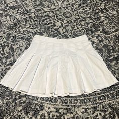 New Without Tags, Has A Dirt Mark On The Inside Of One Of The Pleats From Moving. Juniors Xl. Has A Side Zipper And Button White Cotton School Skirt, Trendy White Tennis Skirt For School, White Cotton Pleated Skirt, White Flowy Cotton Pleated Skirt, White Stretch Mini Skirt For School, White Stretch Tennis Skirt For School, Casual Cotton Flowy Tennis Skirt, Preppy White Cotton Pleated Skirt, White Stretch Skort For School