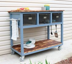 a blue cart with some utensils on it