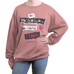 Celebrate your love for the iconic and quotable film Mean Girls from 2004 with fun, officially licensed apparel for the whole family that is definitely "so fetch"! This Juniors' Mean Girls On Wednesdays We Wear Pink Burn Book Pink Graphic Pullover Sweatshirt features the iconic quote from the film: "On Wednesdays We Wear Pink" in black, white, and pink in the style of the "Burn Book" across the front. Grab some Mean Girls apparel today and get in on all the fun! Desert Pink, Book Graphic, Wednesdays We Wear Pink, So Fetch, Burn Book, Cozy Pullover, Fleece Sweatshirt, Pink Sweatshirt, Mean Girls