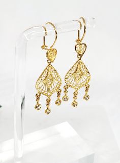 10 karat Genuine Gold Intricate Filigree Designed Teardrop Candelier Hanging Earrings with White Cubic Zirconia Gem Stones REAL SOLID GOLD, NOT PLATED OR FILLED, STAMPED 10KT  Please note, vintage pieces may have slight imperfections due to handling over extended time. Any significant flaws will be disclosed. These earrings are in exceptional condition (never worn). Luxury Gold Danglers For Celebration, Luxury Gold-plated Gold Danglers, Luxury Yellow Gold Sterling Silver Chandelier Earrings, Luxury Gold Danglers In Sterling Silver, Luxury 22k Gold Danglers For Celebration, Luxury Pierced Chandelier Earrings For Anniversary, Exquisite Diamond Chandelier Earrings In Gold, Luxury Yellow Gold Chandelier Earrings For Anniversary, Luxury Gold Chandelier Earrings With Cubic Zirconia