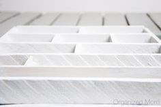 a close up view of white marble blocks with lines on them in the shape of squares and rectangles