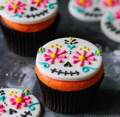 cupcakes decorated with sugar skulls and flowers