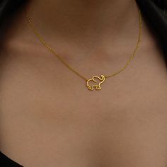 "Choose this beautiful elephant necklace for a cute reminder of mindful moments. Created by hand this gorgeous gold elephant necklace makes a perfect gift for the person who brings you joy. Wear this wealthy symbol necklace close to your heart to share with others how much you deeply care about their well being.  * Material: 14K Solid Gold (real solid gold, no gold-filled or no gold plated material), 925 Sterling Silver  * Choice of Gold Color: Yellow Gold, Rose Gold, White Gold  * Closure: Spring ring  * Chain style: Cable  * Style: Minimalist Thinking of gifting? Elevate your order with our Christmas Gift Wrap option! 🎁 Buy from here! https://www.etsy.com/listing/1580219719/ M O R E F R O M U S Mionza Jewels' pieces are handcrafted by 30 years of experienced craftsmen and made to order. Simple Gold Pendent Designs, Elephant Jewelry Necklace, Location Names, African Necklaces, Gold Elephant Pendant, Elephant Necklace Gold, Beautiful Elephant, Mindful Moments, Minimal Gold