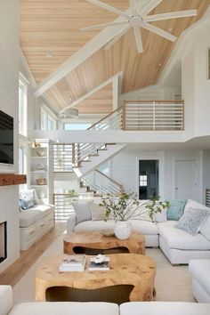 a living room filled with furniture and a fire place