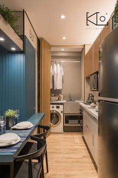 a kitchen and dining area with washer and dryer