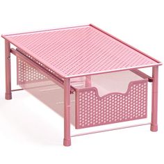 a pink coffee table with two baskets underneath it on a white background and the top half open