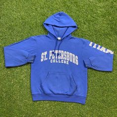 Vintage St Petersburgh College Sweatshirt Good Vintage Condition Made by Champion in Honduras Each Vintage item is unique and fits differently. Please refer to measurements for the best fit. Size Small Width 20.5 in Length 24 in * I ship all items in two to three business days and utilize Priority Mail options via USPS. Expedited shipping is available upon request. If you have any questions; Please Ask! * All of my items are pre-owned and, unfortunately, sometimes have scuffs, stains, or other s Oversized Cotton Sweatshirt Fan Apparel, Collegiate Long Sleeve Hoodie With Logo Print, Oversized Collegiate Hoodie With Crew Neck, Blue Varsity Oversized Sweatshirt, Blue Oversized Varsity Sweatshirt, Oversized Vintage Hoodie For College, Oversized Crew Neck Hoodie For Sports Season, Oversized Hoodie Sweatshirt For Sports Season, Oversized Sweatshirt For Sports Season