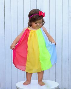 Panels of rainbow colors add a fun flair to this twirl-worthy shift dress. 100% polyester skirt We recommend hand washing and hang drying this article of clothing. Cute Multicolor Dress For Dress-up, Fun Multicolor Summer Dress, Rainbow Summer Dress For Playtime, Rainbow Summer Dresses For Playtime, Colorful Playful Sleeveless Dress, Summer Rainbow Playtime Dress, Colorful Sleeveless Playful Dress, Playful Multicolor Sundress For The Beach, Fun Multicolor Sundress For Playtime