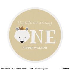 a round sticker with the words one, and a polar bear crown on it