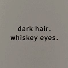 the words dark hair, whiskey eyes written in black ink