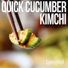 the words quick cucumber kimchi hang from chopsticks