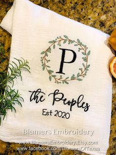 a white towel with the words, the peoples est 2020 on it next to some sliced oranges