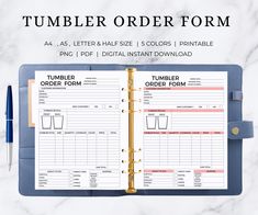 a binder order form on top of a marble table with a pen and clipboard