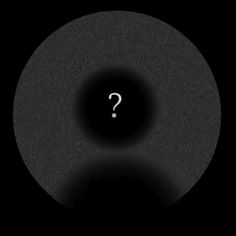 a black circle with a question mark on it in the middle, and a dark background