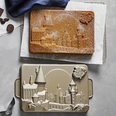 two cookie pans with castle designs on them