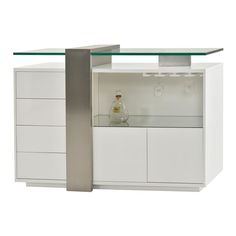 a white cabinet with a glass top and silver handles on the bottom, in front of an empty bottle