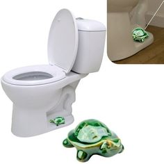 a white toilet sitting next to a green turtle