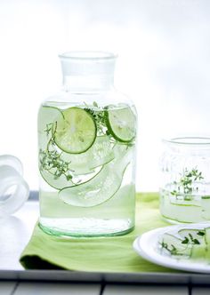 a pitcher filled with water sitting on top of a table