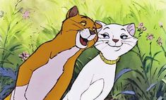 an animated image of two cats touching each other's foreheads in the grass