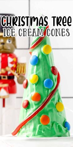 a christmas tree made out of ice cream and gummy balls with the words, christmas tree ice cream cones